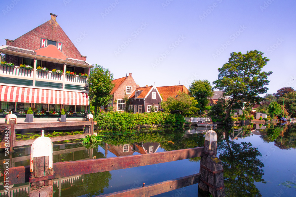 Scene from picturesque cheese-making town of Edam, Holland with historic architecture and canal