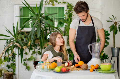 awesome chef showing the girl how toprepare tasty fresh drink. close up photo photo