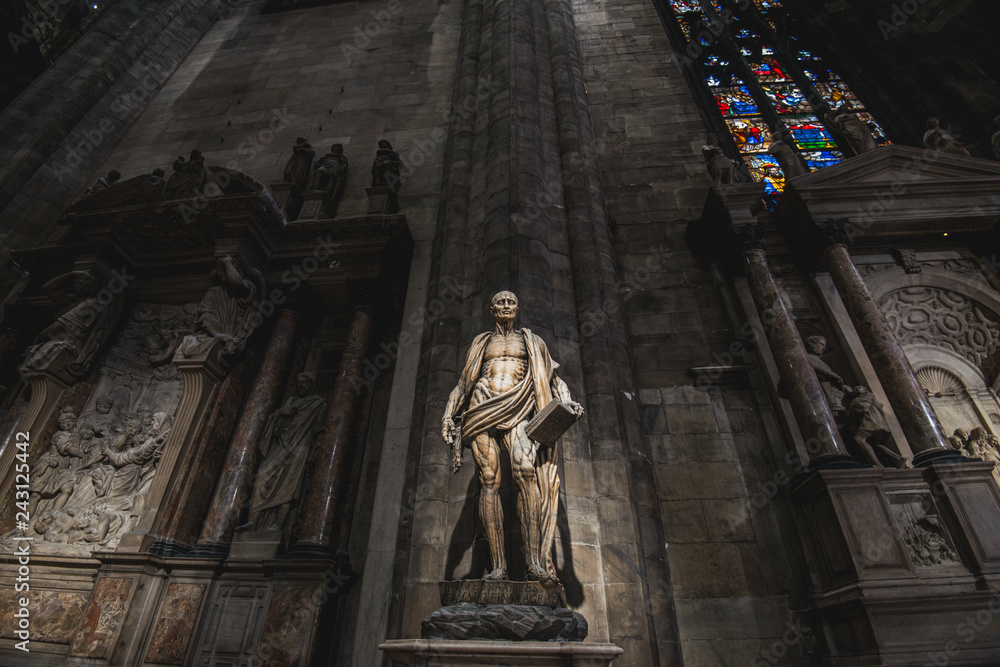 MILAN, ITALY - AUGUST 20, 2018: St. Bartholomew statue in Duomo di Milano (Dome of Milan), Milan, Italy. St Bartholomew was one of 12 Apostles and an early Christian martyr that was skinned