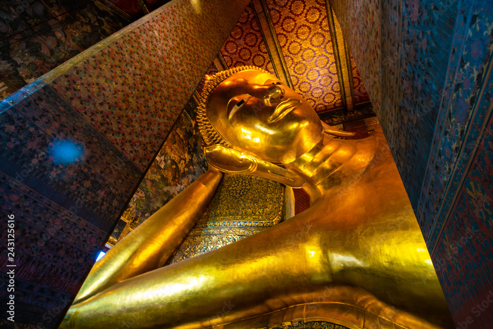 Gold statue reclining buddha indoor of Wat Pho buddhist temple