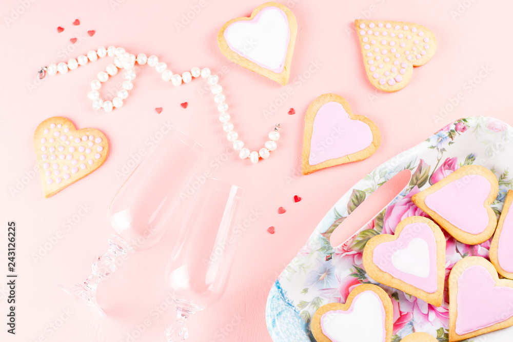 Happy Valentine's day greeting card with heart cookies, wine glasses and wine on pastel pink background. Happy Valentine's day greeting card with heart cookies, wine glasses and wine on pastel pink background.