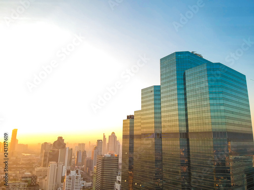 Aerial view of Bangkok modern office city building colorful sunrise