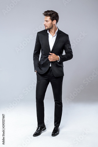 Sexy man in black suit with beautiful hair