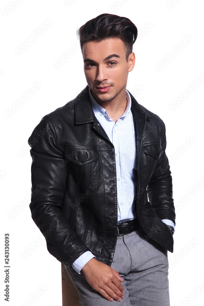 Fototapeta premium relaxed smart casual man wearing leather jacket holds pockets