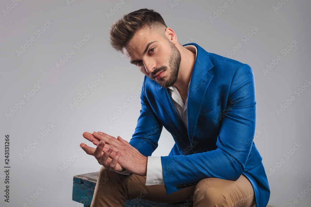 sexy smart casual man sitting and 