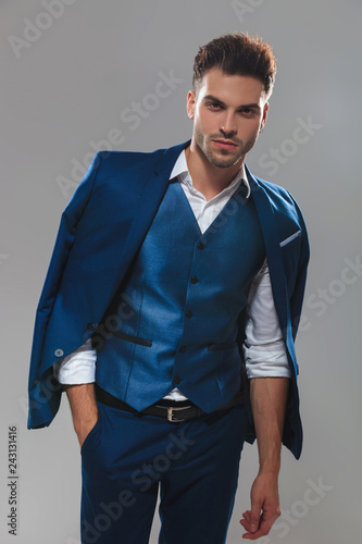 Fotografija potrait of relaxed man wearing blue waistcoat and suit