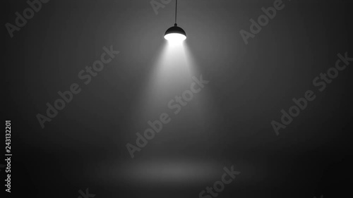 Stage with spot lighting single swinging lamp, shining empty monochrome scene for show on the dark gray brutal background. Looped 4K motion graphic.