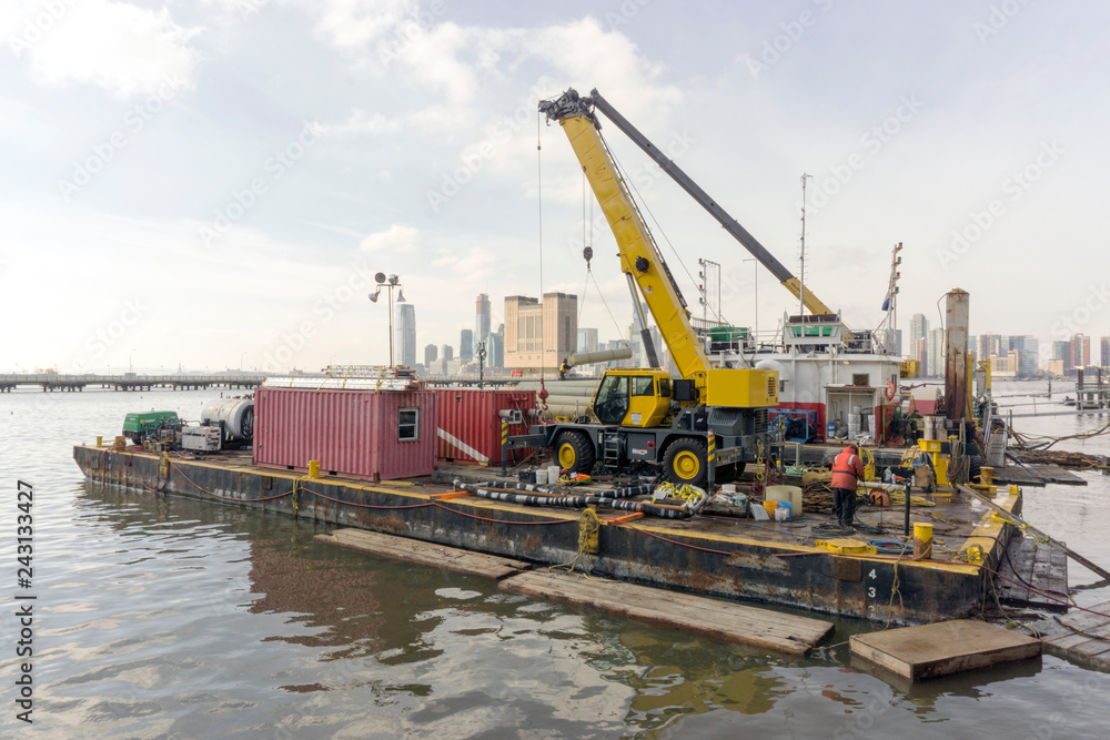 cranes, containers and construction pier in the port in New York