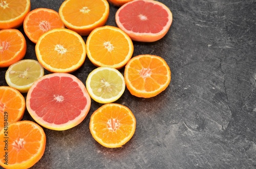 orange lemon fruits slices on kitchen table