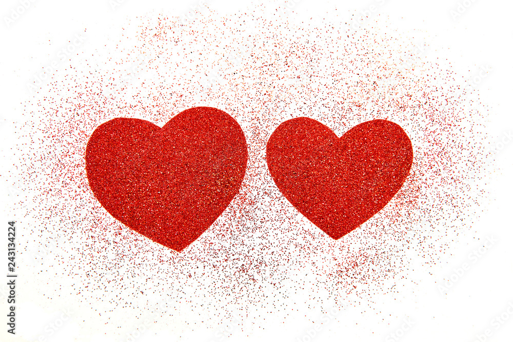 Two red hearts with sequins on white background