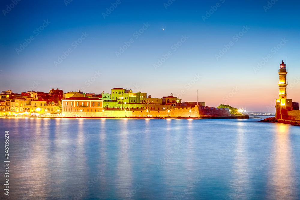Night Panorama of Old Venetian City of Chania Taken at Blue Hour from Pier with the Lighthouse in Background.