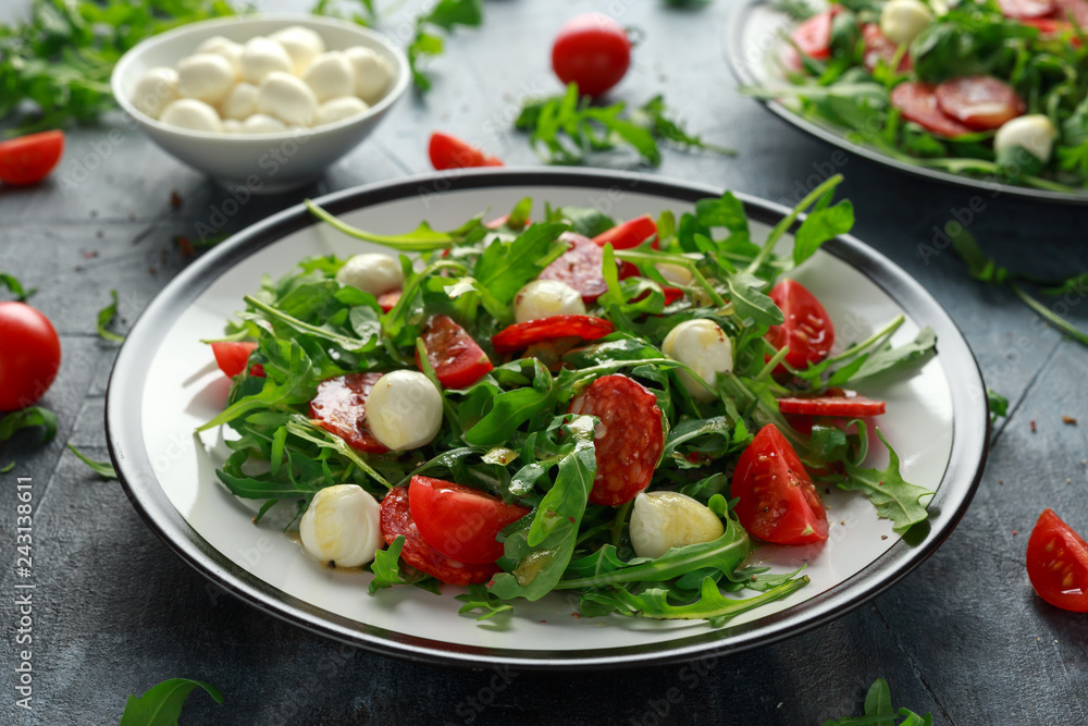 Chorizo salad with cherry tomatoes, mozzarella and wild rucola Chorizo salad with cherry tomatoes, mozzarella and wild rucola