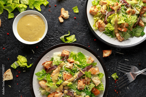 Caesar salad with chicken, anchous fish, croutons, parmesan cheese and greens. healthy food