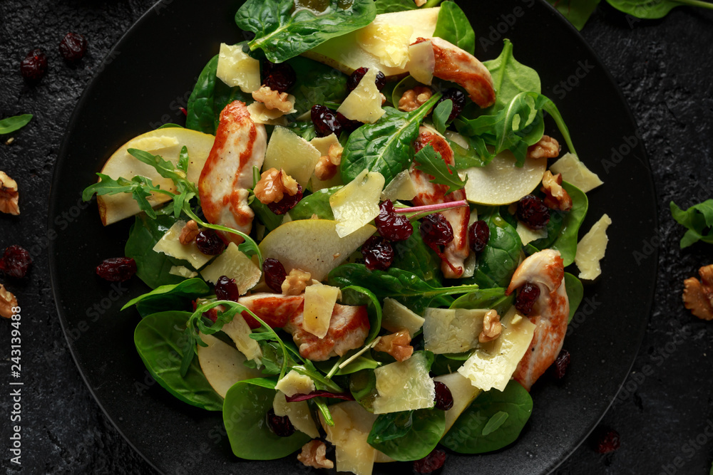 Pear, chicken salad with cheddar cheese, cranberry and walnuts. healthy food