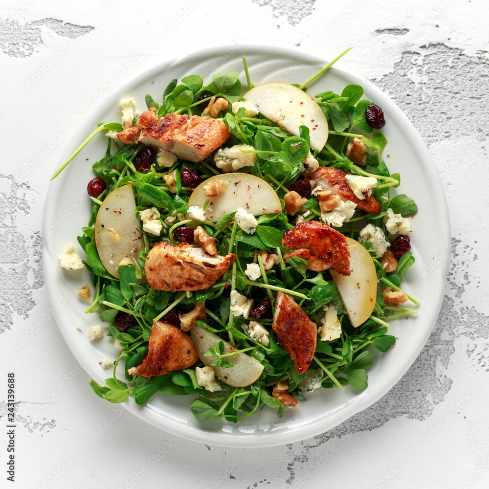 Pear, chicken salad with blue cheese, cranberry and walnuts. concept healthy food Pear, chicken salad with blue cheese, cranberry and walnuts. concept healthy food