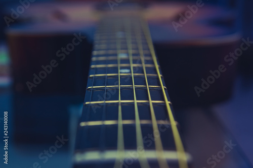 Guitar neck, strings, frets.