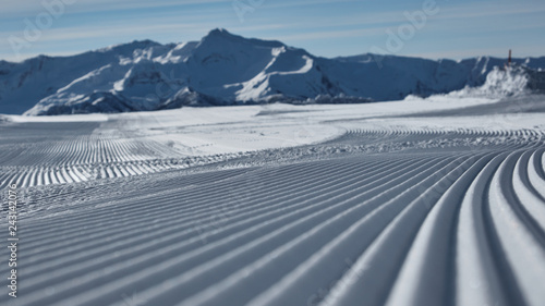 Prepared ski slope with a snow lines