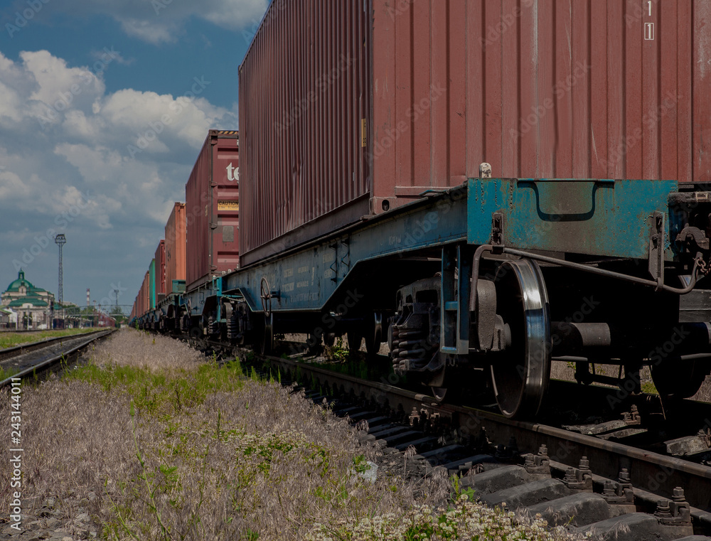 Container loaded on train wagons on a railway Container loaded on train wagons on a railway