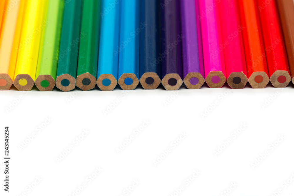 Colour pencils on white background, top view. Colour pencils on white background, top view.