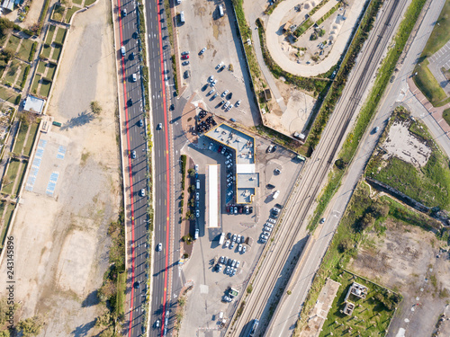 Gas station and Highway road - Top down aerial image.