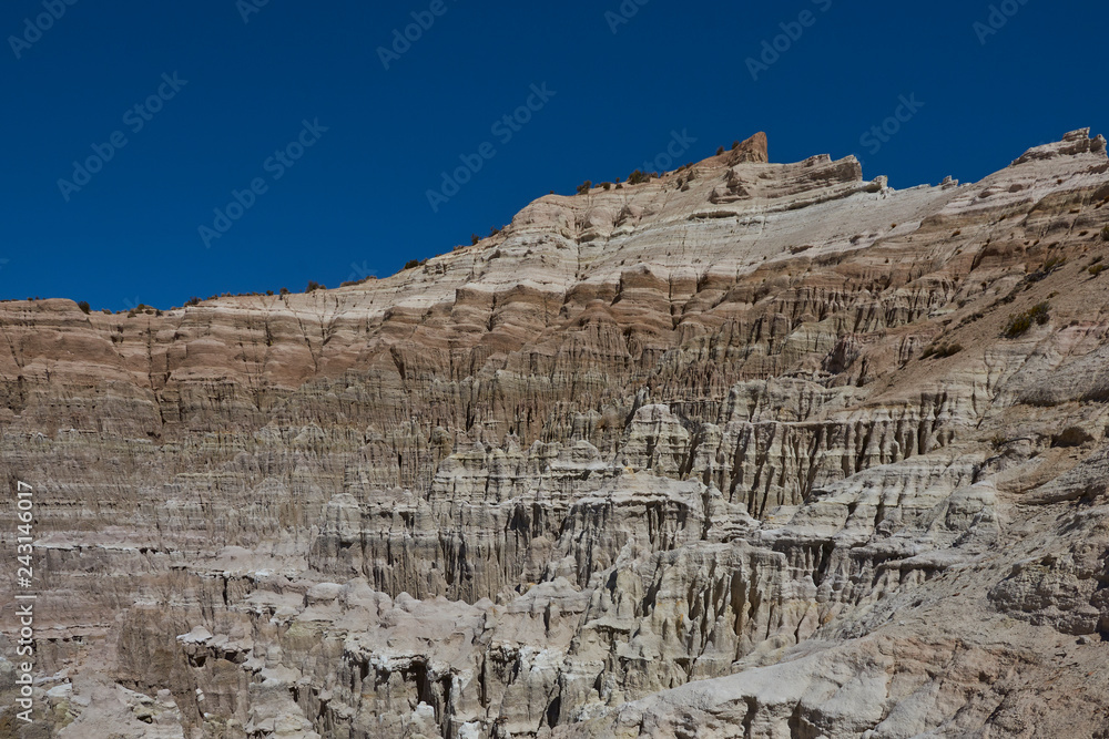 Fototapeta premium Eroded rock formations along Quebrada Chuba, a river valley high on the Altiplano of northern Chile in Lauca National Park.