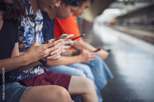 Group of friends using digital smartphones outdoor with having fun with technology trends , Teen lifestyle social media concept