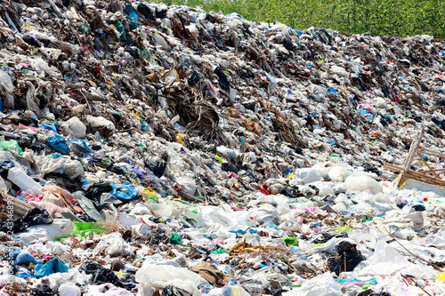 Mountain garbage, large and degraded garbage pile, Pile of stink and toxic residue, waste plastic bottles and other types of plastic waste site in trash dump or landfill. Pollution concept.