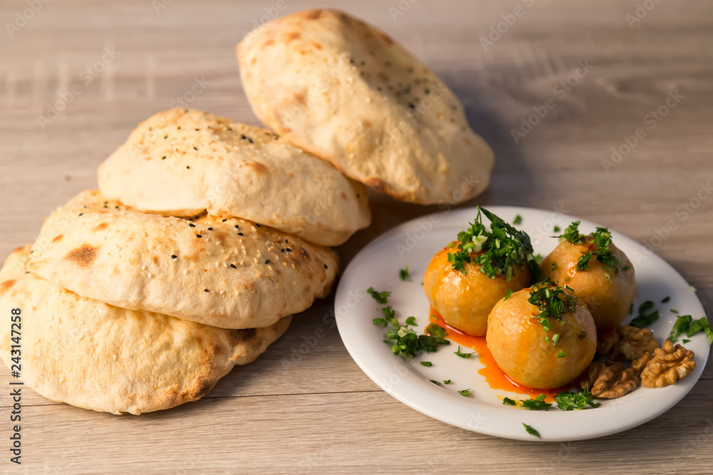 Icli Kofte, Kibbeh,stuffed meatballs in the plate with different service for cafe menu. Icli Kofte, Kibbeh,stuffed meatballs in the plate with different service for cafe menu.