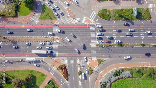 Photography Top down aerial image of traffic on a busy Junction with cars and trucks