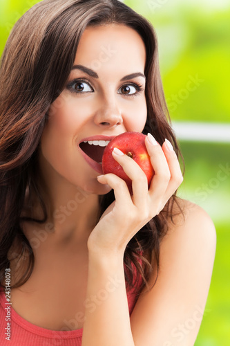  smiling woman with apple