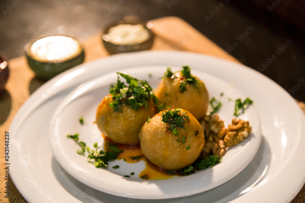 Icli Kofte, Kibbeh,stuffed meatballs in the plate with different service for cafe menu. Icli Kofte, Kibbeh,stuffed meatballs in the plate with different service for cafe menu.