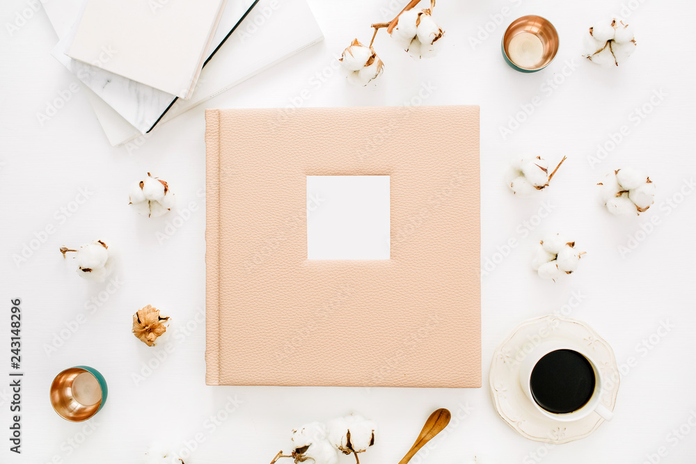 Composition with wedding or family photo album, cotton buds, coffee cup on white background. Flat lay, top view still life concept. Composition with wedding or family photo album, cotton buds, coffee cup on white background. Flat lay, top view still life concept.