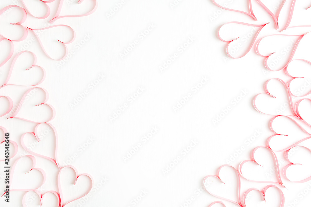 Wreath frame made of paper heart symbols on white background. Flat lay, top view Valentines Day background love concept. Wreath frame made of paper heart symbols on white background. Flat lay, top view Valentines Day background love concept.