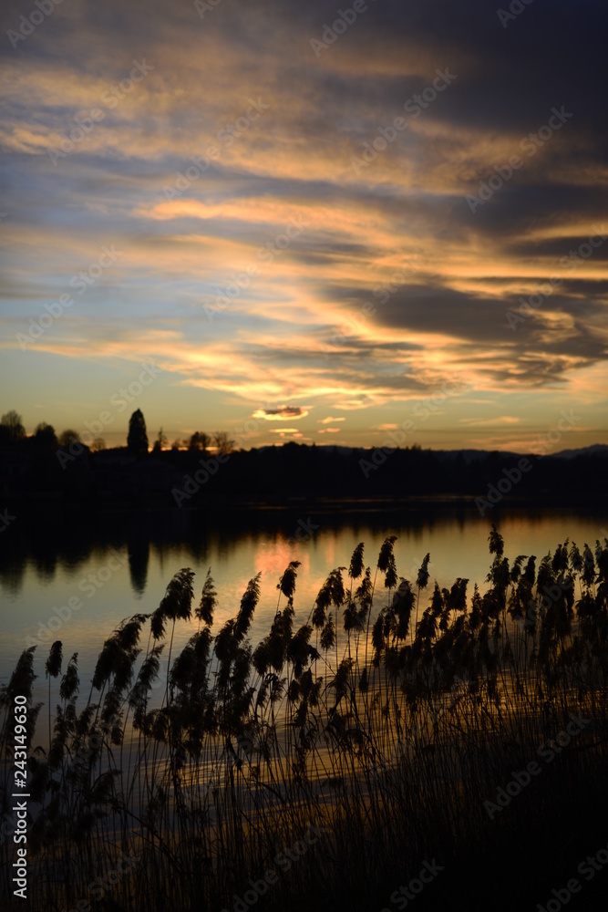 Naklejka premium Sesto Calende. sunset on the river