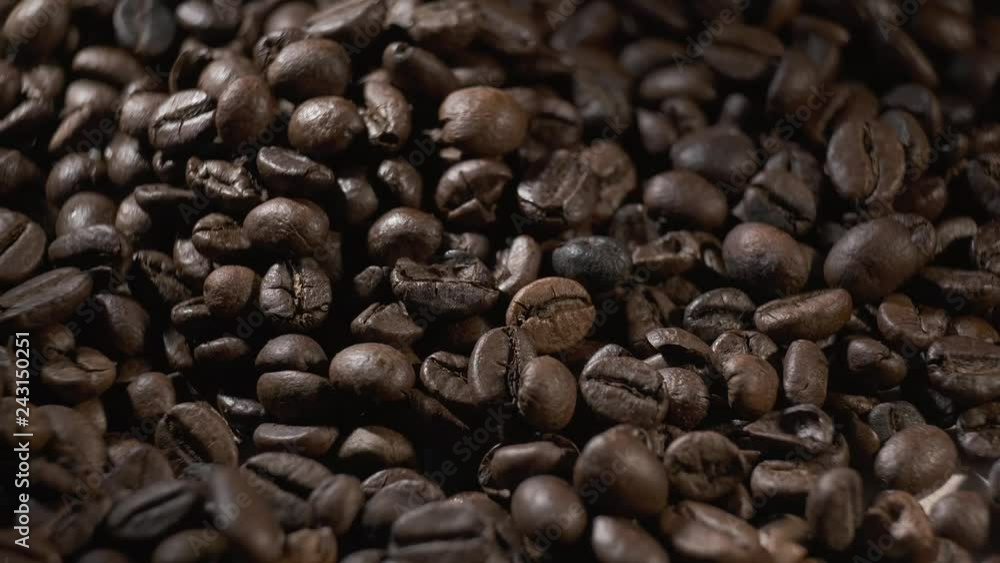 Many Coffee beans rotating. Macro 4K resolution. Many Coffee beans rotating. Macro 4K resolution.