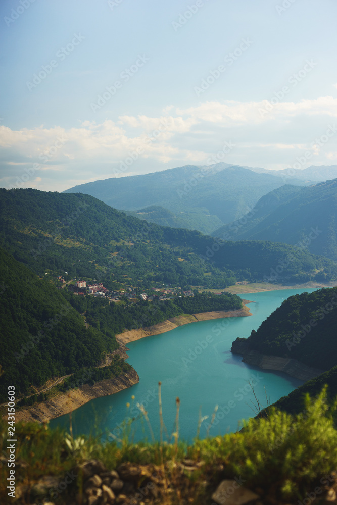 Stunning views from the top of the mountains, the valley and the man-made reservoir in Montenegro.