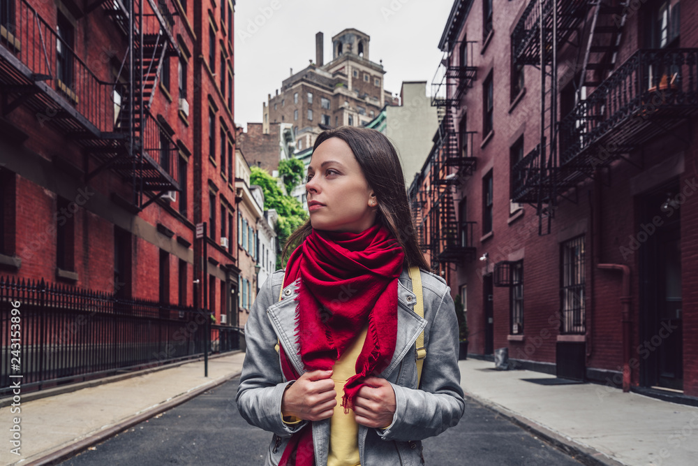 Attractive girl with a red scarf on the street