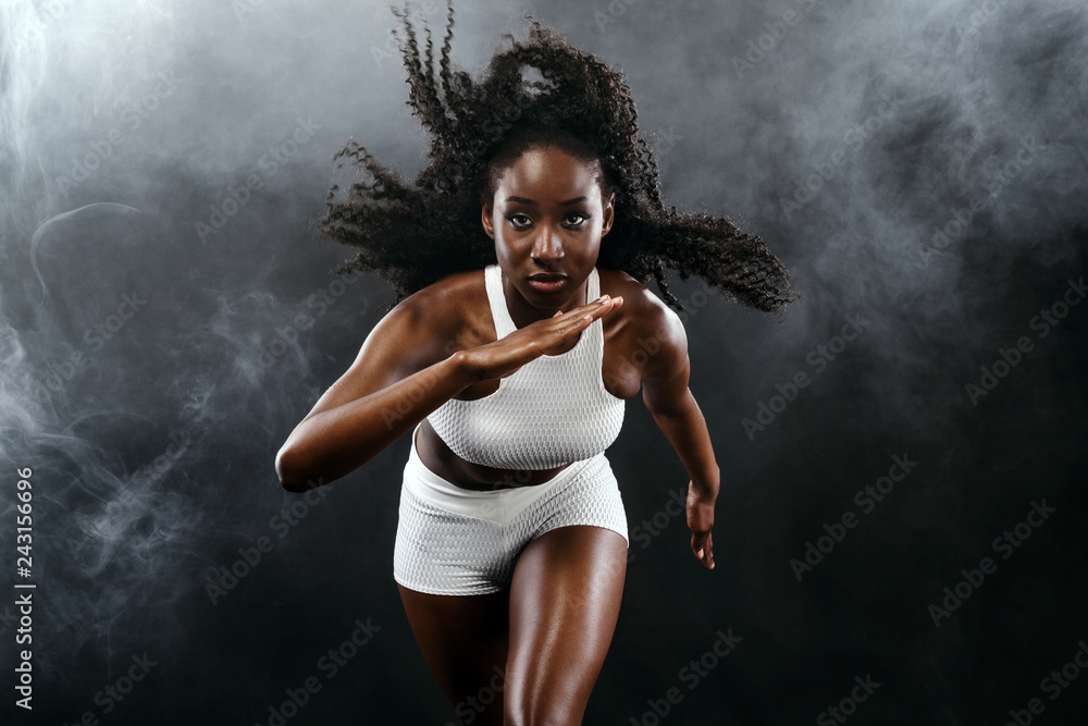 A strong athletic, female sprinter, running at sunrise wearing in the  sportswear, fitness and sport motivation concept with copy space. Stock  Photo by ©MikeOrlov 171278364