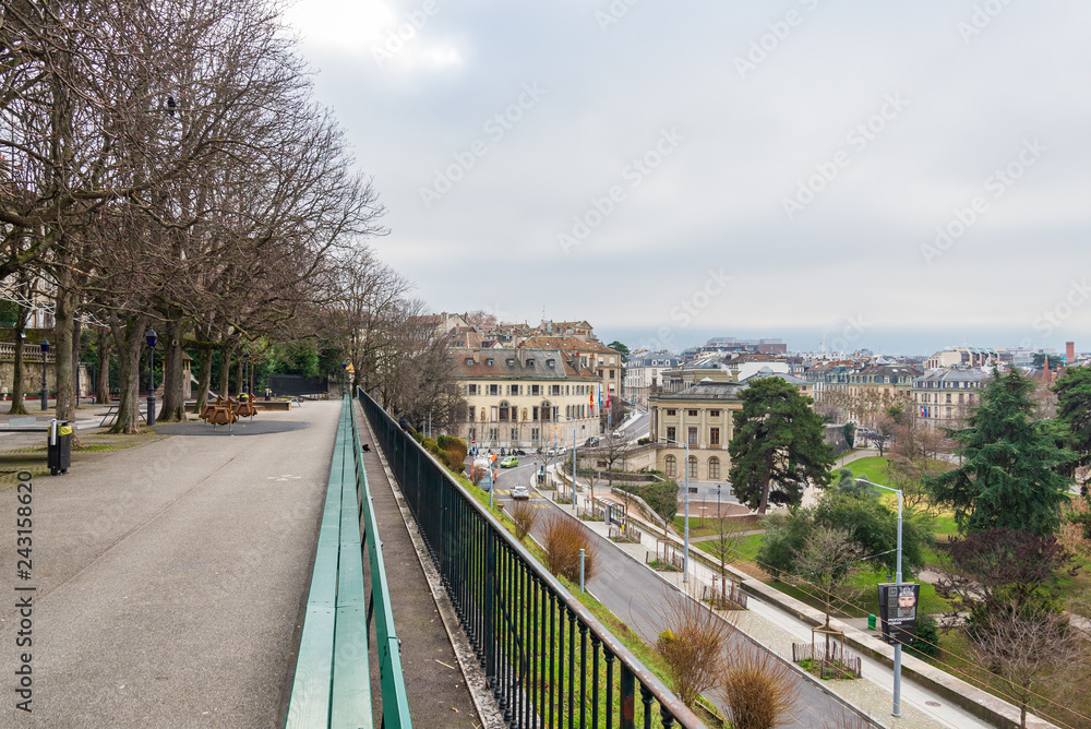 Top view from Place de jeux de la promenade de la Treille,  Geneva's oldest promenade near old town, with green longest bench in the world and lower Geneva town.