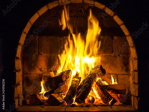 Wood burning in a cozy fireplace at home, keep warm