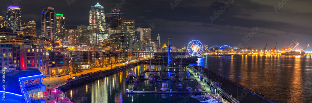 Seattle waterfront view with urban architecture at night