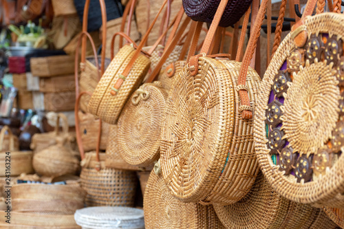 Balinese handmade rattan eco bags in a local souvenir market in Bali, Indonesia photo