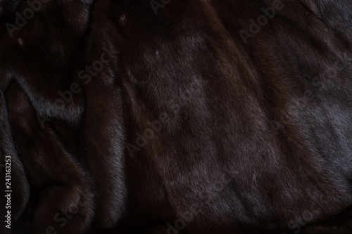 Natural mink fur brown. Texture, background. Natural brown mink coat close up, short nap
