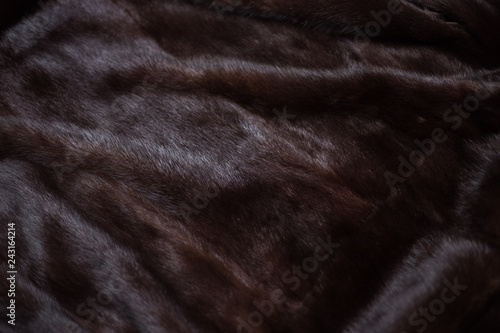 Natural mink fur brown. Texture, background. Natural brown mink coat close up, short nap