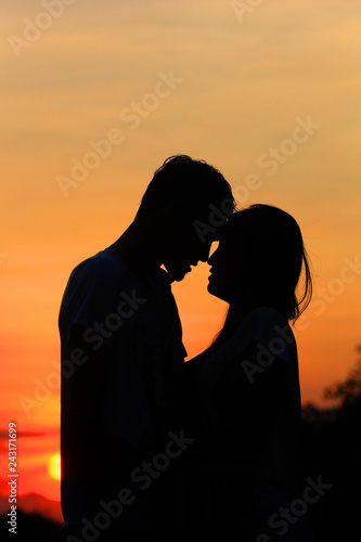 romantic silhouette of a pair of lovers © endriyana