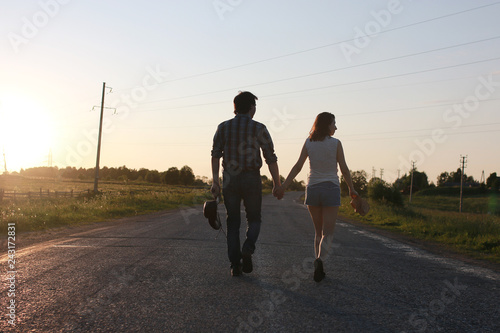 Cute couple on a walk by the countryside