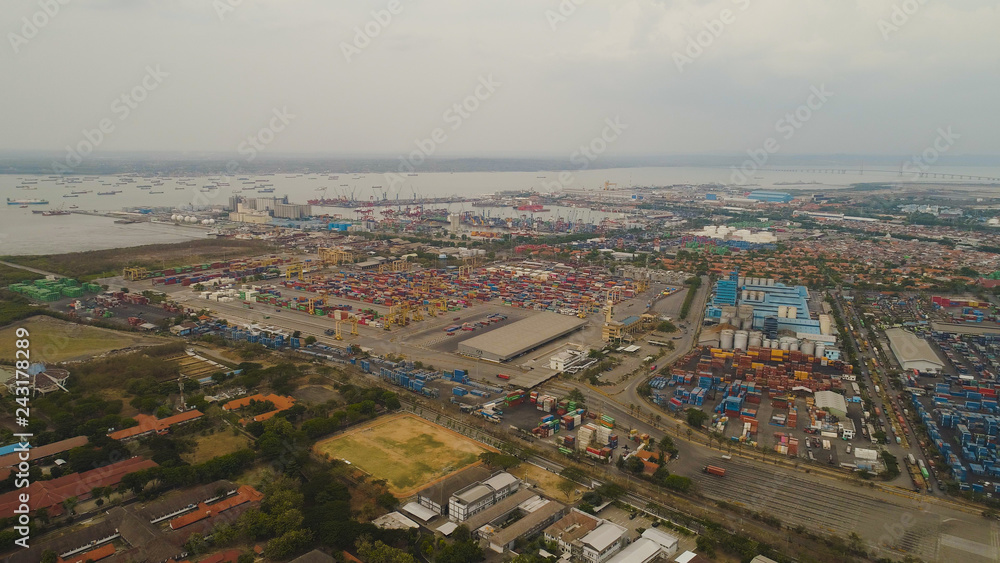 aerial view container terminal port surabaya. cargo industrial port with containers, crane. Tanjung Perak, indonesia. logistic import export and transport industry