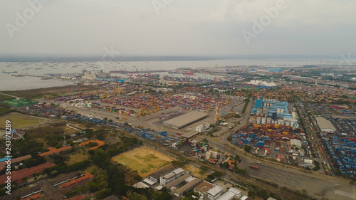 aerial view container terminal port surabaya. cargo industrial port with containers, crane. Tanjung Perak, indonesia. logistic import export and transport industry