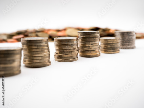 Image of pile of Euro coins with cent coins in the background close up