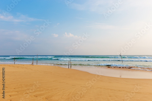 Landscape of sand beach and sea with blue sky